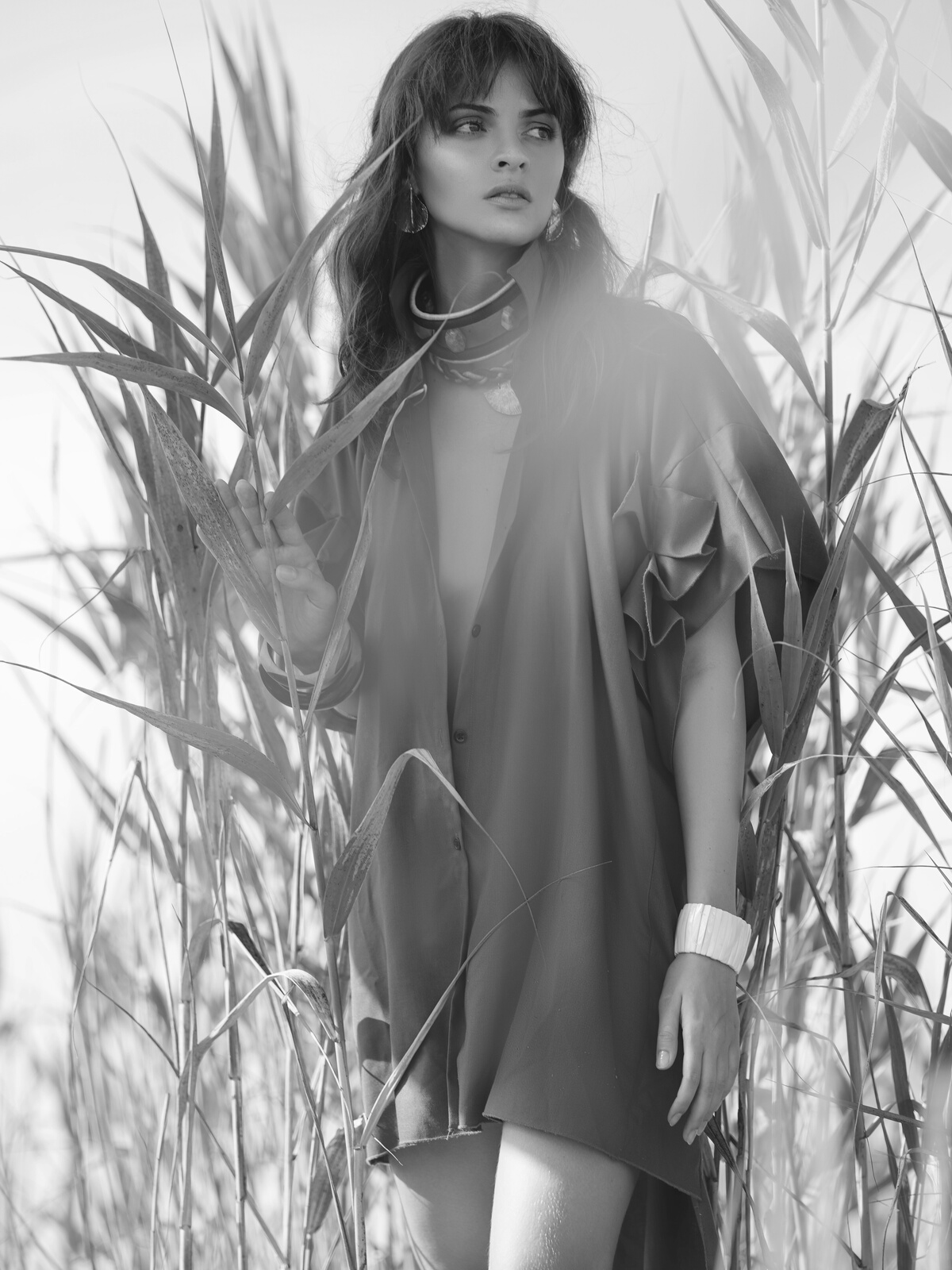 Model standing Besidde Crops